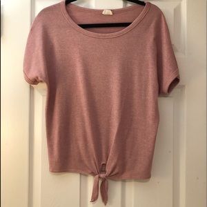 pink shirt with a tie in the front